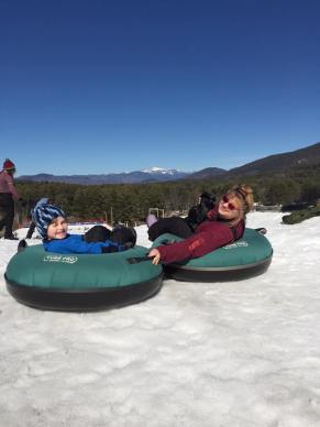 tim and mommy snowtubing grins atop  cranmore 2016.jpg